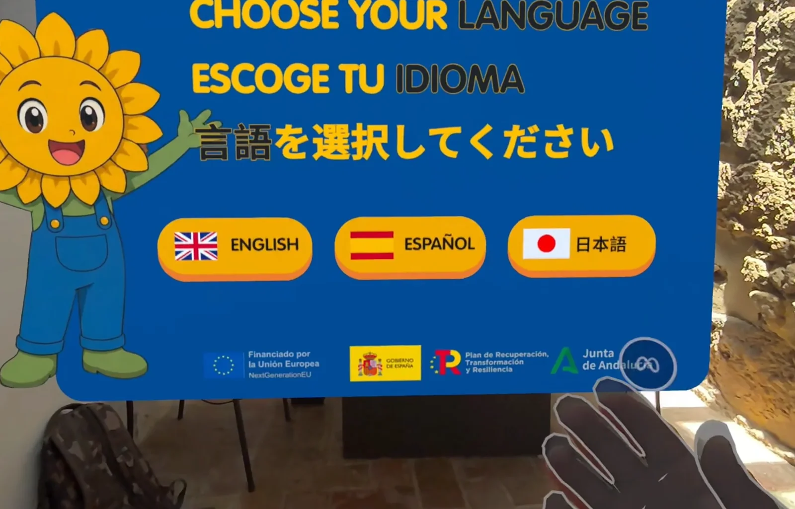 Selector de idioma de la experiencia, con la mascota Pipo: inglés, español y japonés